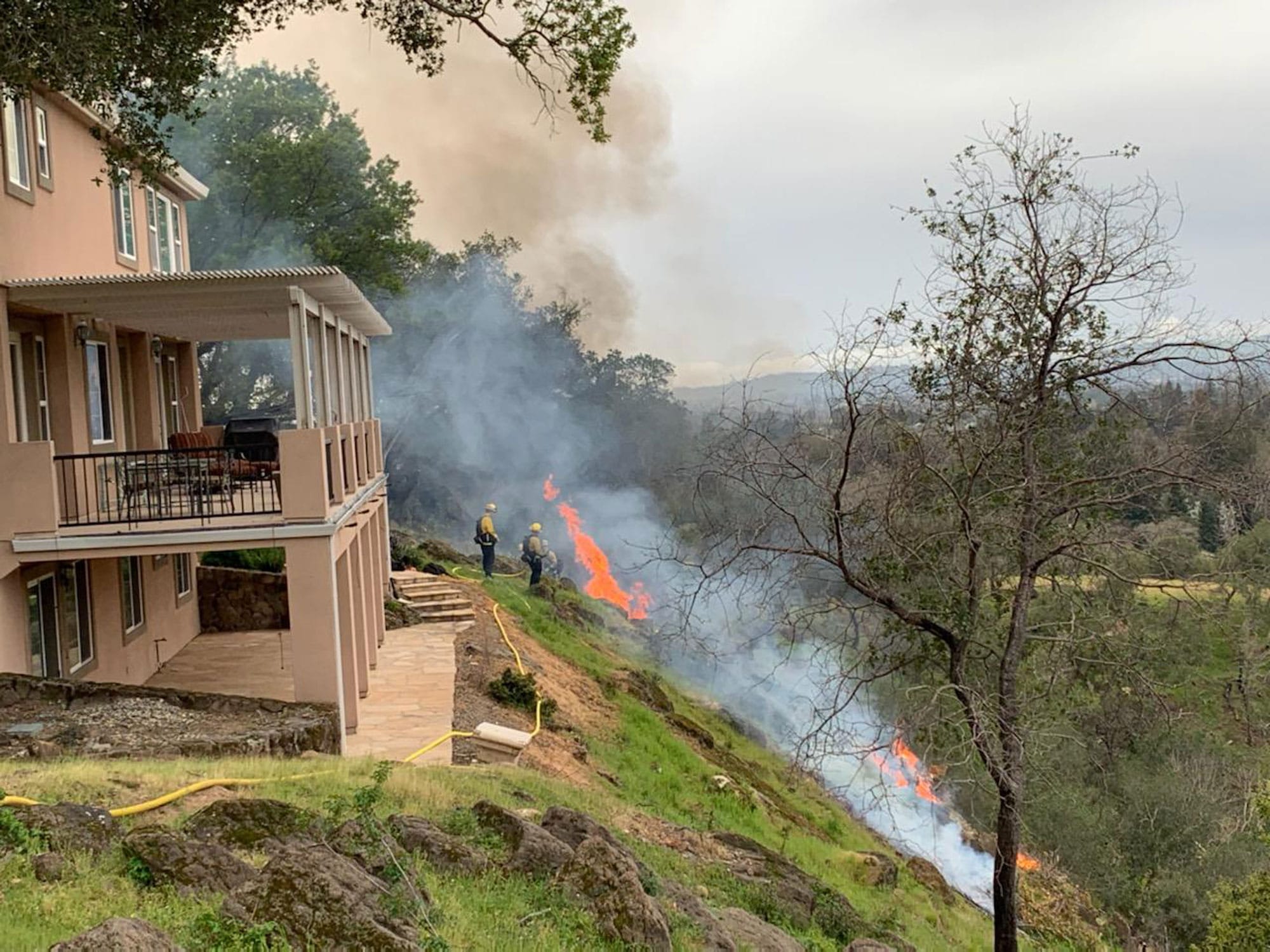 Controlled fires on steep inclines leading to a house