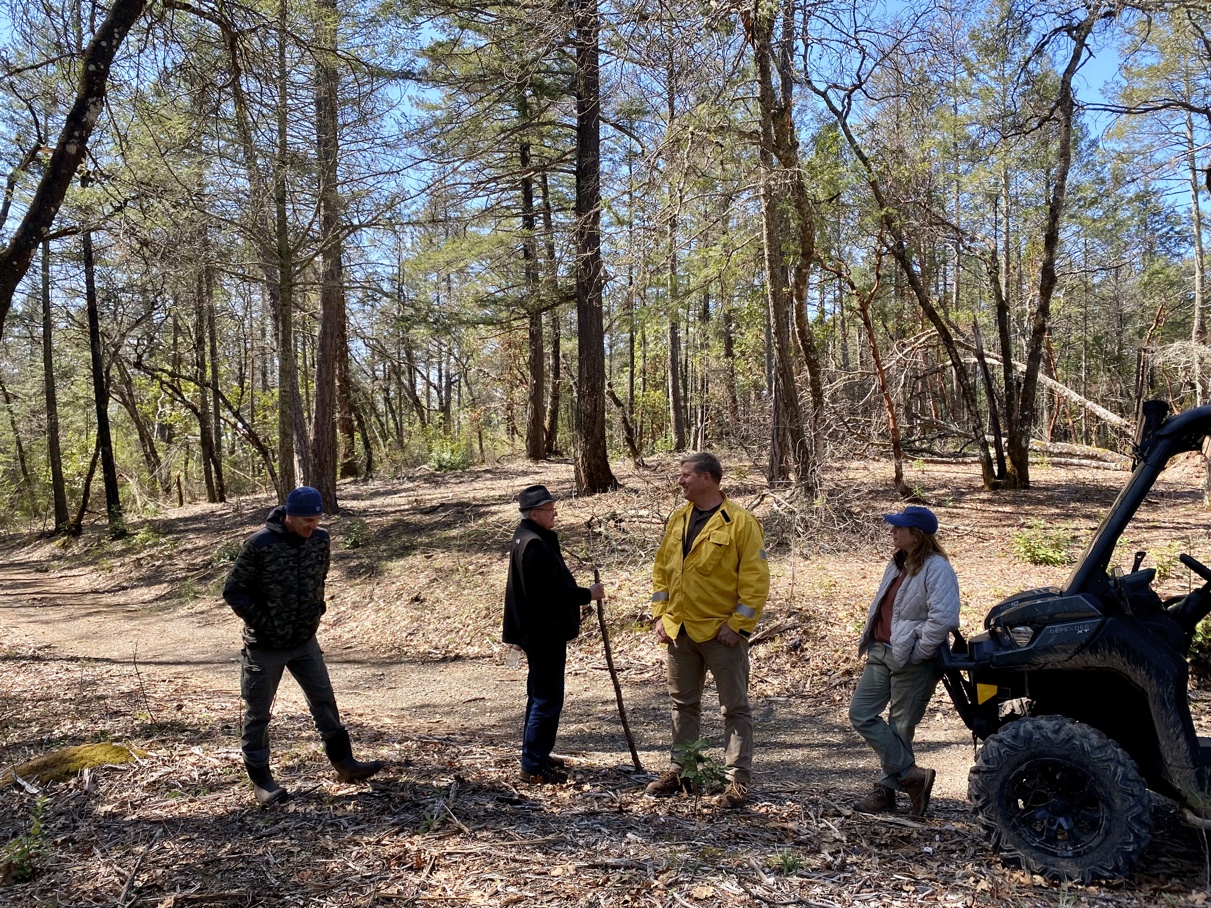 group of CalFire forestry officials in a wooded area