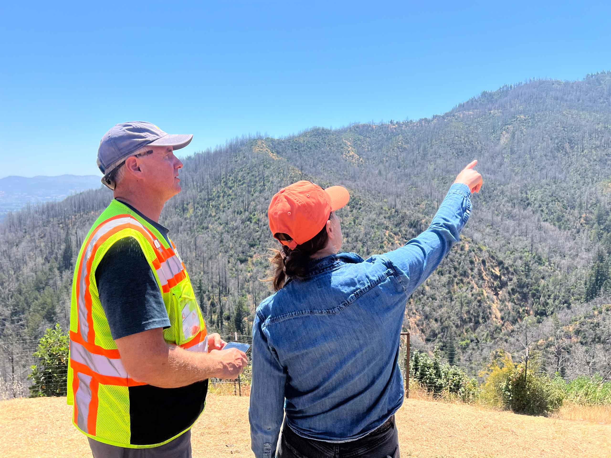 two Napa Firewise team members surveying hillsides